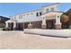 Striking home featuring stone veneer, multiple garage bays and a beautifully paved driveway at 1319 Red Baron Ln, Boulder City, NV 89005
