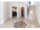 Stunning foyer with decorative tile flooring, staircase, and access to the theater room at 1319 Red Baron Ln, Boulder City, NV 89005