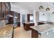 Modern kitchen with granite countertops, stainless steel appliances, and a large island for entertaining at 1319 Red Baron Ln, Boulder City, NV 89005