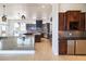 Gourmet kitchen features granite countertops, custom cabinets, and a wine refrigerator for added convenience at 1319 Red Baron Ln, Boulder City, NV 89005