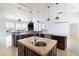 Elegant kitchen with dual islands, granite countertops, and stainless steel appliances for entertaining guests at 1319 Red Baron Ln, Boulder City, NV 89005