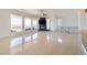 Spacious living room featuring tile flooring, a fireplace, and a view of the mountains and balcony at 1319 Red Baron Ln, Boulder City, NV 89005