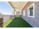 Picturesque patio with faux grass, stone accents, and mountain vistas at 1319 Red Baron Ln, Boulder City, NV 89005