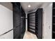 Large walk-in closet with custom dark shelving and ample storage space at 1319 Red Baron Ln, Boulder City, NV 89005