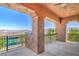 Balcony with scenic views of the desert landscape, mountains, and a tennis court at 15 Via Mantova # 302, Henderson, NV 89011