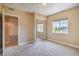 Bedroom with an exterior view, closet, and neutral-colored walls and carpet at 15 Via Mantova # 302, Henderson, NV 89011