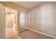 Cozy bedroom features a mirrored closet and access to a laundry room at 15 Via Mantova # 302, Henderson, NV 89011