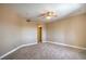 Large bedroom with neutral carpet, a ceiling fan, and an ensuite bathroom at 15 Via Mantova # 302, Henderson, NV 89011