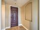 Elegant entryway features an alcove and beautiful dark wood door creating a lasting first impression at 15 Via Mantova # 302, Henderson, NV 89011