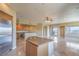 Open concept kitchen with island, stainless appliances, and a wine fridge with scenic views at 15 Via Mantova # 302, Henderson, NV 89011