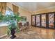 Lobby with decorative iron doors, tiled floors, and a tropical plant in a decorative pot at 15 Via Mantova # 302, Henderson, NV 89011