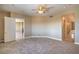 Spacious main bedroom with neutral carpet and ensuite bathroom at 15 Via Mantova # 302, Henderson, NV 89011