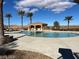 Enjoy the community pool area, featuring a covered seating area, ample deck space, and mountain views at 15 Via Mantova # 302, Henderson, NV 89011