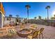 Inviting backyard with a brick fire pit and outdoor seating, perfect for entertaining guests and relaxing outdoors at 1564 Vegas Valley Dr, Las Vegas, NV 89169