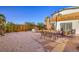 Expansive backyard featuring multiple seating areas and lush greenery at 1564 Vegas Valley Dr, Las Vegas, NV 89169