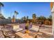 Spacious backyard featuring various seating arrangements and gravel landscaping at 1564 Vegas Valley Dr, Las Vegas, NV 89169