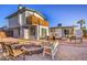 Large backyard featuring a cozy fire pit and a variety of comfortable seating arrangements at 1564 Vegas Valley Dr, Las Vegas, NV 89169