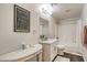 Bright bathroom featuring a vanity and shower-tub combination at 1564 Vegas Valley Dr, Las Vegas, NV 89169