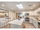 Spacious kitchen with an island and an open layout perfect for entertaining at 1564 Vegas Valley Dr, Las Vegas, NV 89169