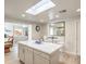 The kitchen features a large island with seating that opens to the living room at 1564 Vegas Valley Dr, Las Vegas, NV 89169