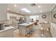 Bright kitchen featuring quartz countertops, stainless steel appliances, and an island with bar stool seating at 1564 Vegas Valley Dr, Las Vegas, NV 89169