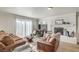 Bright living room with a decorative fireplace and large glass doors at 1564 Vegas Valley Dr, Las Vegas, NV 89169