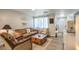 Cozy living room featuring a comfortable sofa, accent chairs, and a decorative wooden coffee table at 1564 Vegas Valley Dr, Las Vegas, NV 89169