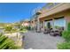 Luxurious backyard with water feature, spiral staircase, and lush landscaping for ultimate relaxation at 16 Mallard Creek Trl, Henderson, NV 89052