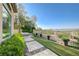 Secluded backyard featuring a hot tub, patio area, and stunning city views at 16 Mallard Creek Trl, Henderson, NV 89052