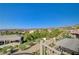 Backyard view with lush greenery, desert plants, and mountains in the background offering a serene outdoor ambiance at 16 Mallard Creek Trl, Henderson, NV 89052