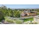 Backyard view overlooking neighboring homes with mountains in the background offering a serene outdoor ambiance at 16 Mallard Creek Trl, Henderson, NV 89052