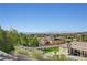 Backyard view overlooking neighboring homes with mountains in the background offering a serene outdoor ambiance at 16 Mallard Creek Trl, Henderson, NV 89052
