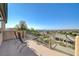 Outdoor balcony with wrought iron seating and railings offers expansive views of the city at 16 Mallard Creek Trl, Henderson, NV 89052