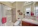 Well lit bathroom featuring a glass shower and vanity with tile backsplash at 16 Mallard Creek Trl, Henderson, NV 89052