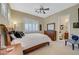 Comfortable bedroom features plantation shutters, ceiling fan and decorative furnishings at 16 Mallard Creek Trl, Henderson, NV 89052