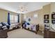 Bright bedroom with two beds, shutters, and matching décor providing a cozy and inviting atmosphere at 16 Mallard Creek Trl, Henderson, NV 89052