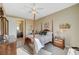 Bright bedroom with a four-poster bed and en-suite bathroom at 16 Mallard Creek Trl, Henderson, NV 89052