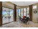 Breakfast nook with big window and sliding doors to the patio and seating at 16 Mallard Creek Trl, Henderson, NV 89052