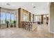 Open-concept breakfast nook with barstool seating and big window with access to patio at 16 Mallard Creek Trl, Henderson, NV 89052