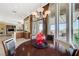Cozy breakfast nook with big window and sliding doors to the patio and seating at 16 Mallard Creek Trl, Henderson, NV 89052