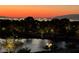 Las Vegas city view at dusk with a pond in the foreground at 16 Mallard Creek Trl, Henderson, NV 89052
