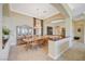Traditional dining room features a wood table and chairs beneath an elegant chandelier at 16 Mallard Creek Trl, Henderson, NV 89052