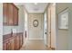 Hallway with cabinets and a neutral color scheme at 16 Mallard Creek Trl, Henderson, NV 89052