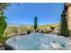 Backyard hot tub with jets and manicured desert landscaping and views at 16 Mallard Creek Trl, Henderson, NV 89052