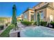 Exterior view of a hot tub with beautiful landscaping and a well manicured yard at 16 Mallard Creek Trl, Henderson, NV 89052
