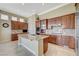 Spacious kitchen with stainless steel appliances, granite countertops, and custom wood cabinets at 16 Mallard Creek Trl, Henderson, NV 89052