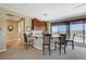 Kitchenette includes a granite countertop, wood cabinets, and a picturesque view at 16 Mallard Creek Trl, Henderson, NV 89052