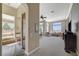 Bright living room features large windows with stunning views and plush seating at 16 Mallard Creek Trl, Henderson, NV 89052