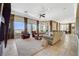 Expansive living room with large windows, natural light, comfortable seating, and an open layout at 16 Mallard Creek Trl, Henderson, NV 89052