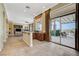 Open living space with access to the outdoor patio and kitchenette at 16 Mallard Creek Trl, Henderson, NV 89052